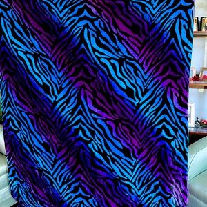 Zebra print blanket. Purple and blue. Soft.